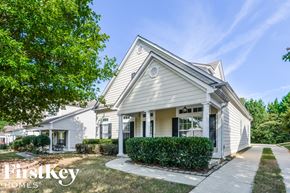 Trussville house for rent - a white house with a sidewalk in front of it