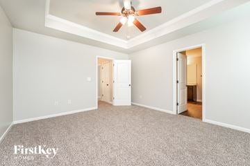 Union City house for rent - a living room with carpet and a ceiling fan