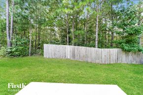 Union City house for rent - the backyard is fenced in with a privacy fence and trees