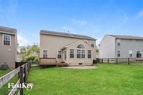 Morrow house for rent - A house with a fence and a grassy yard is for sale.