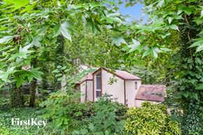 Lilburn house for rent - a small house in the woods surrounded by trees