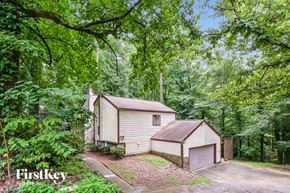 Lilburn house for rent - two sheds in a wooded area with trees