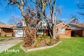 Fort Worth house for rent - a house with three trees in front of it