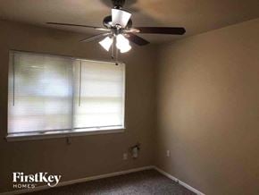 Fort Worth house for rent - a bedroom with a ceiling fan and a window