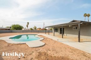 Phoenix house for rent - A house with a pool in the backyard.