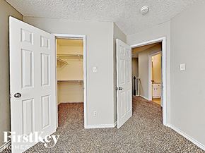Arlington house for rent - a bedroom with a closet and an open door to the bathroom