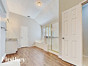 Arlington house for rent - a spacious bathroom with a large mirror and a white door