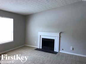 Stone Mountain house for rent - A room with a fireplace and a window.
