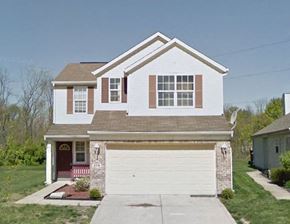 Indianapolis house for rent - A two-story house with a garage and a driveway.
