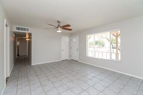 Phoenix house for rent - A spacious room with a ceiling fan and tiled flooring.