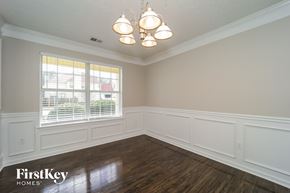 Atlanta house for rent - a dining room with wood floors and a window