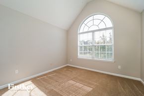 Atlanta house for rent - the second bedroom is spacious and has a large arched window