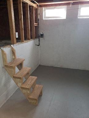 Galloway house for rent - a staircase in a room with wooden steps on the floor