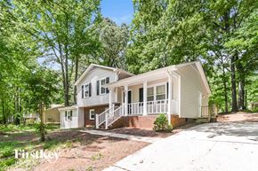 Charlotte house for rent - a white house with a porch and trees