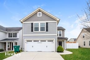 Clemmons house for rent - a white house with a white garage door