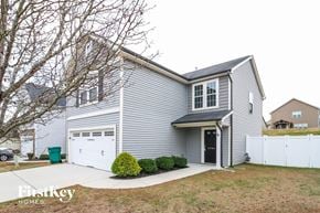 Clemmons house for rent - a gray house with a white garage and a white fence
