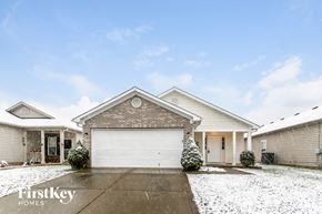 Indianapolis house for rent - A house with a garage and a driveway in front of it.