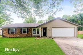 Indianapolis house for rent - A house with a garage and a driveway is shown.