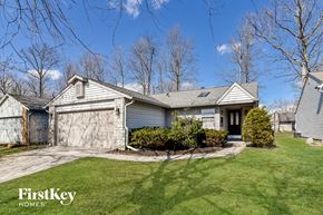 Indianapolis house for rent - a with a driveway and a garage door