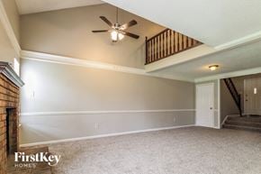 Memphis house for rent - the living room of an empty house with a ceiling fan