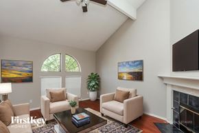 Arlington house for rent - A living room with a fireplace and two chairs.