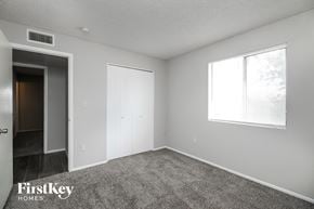 Tempe house for rent - the spacious living room with carpeting and a large window