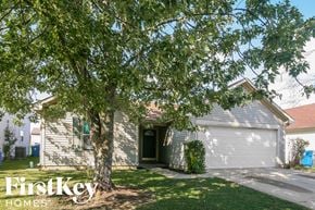 Indianapolis house for rent - a white house with a tree in front of it