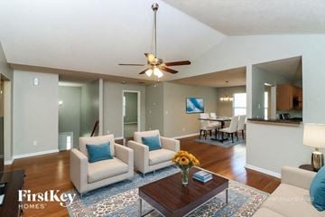Austell house for rent - A living room with a white couch and a brown coffee table.