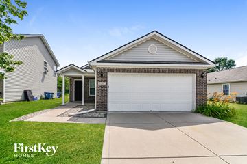 Indianapolis house for rent - a white garage door in front of a house