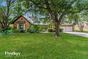Fort Worth house for rent - a small brick house with a tree in front of it
