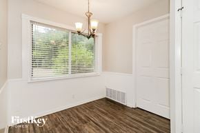 Fort Worth house for rent - a bedroom with a large window and a white door