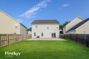 High Point house for rent - A house with a fence and a grassy yard is shown.