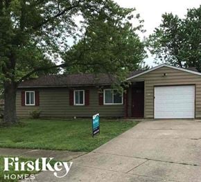 Indianapolis house for rent - A house with a sign that says FirstKey Homes in front of it.