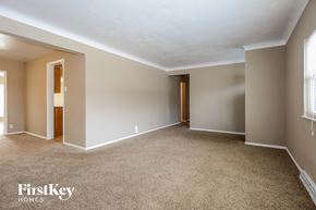 Hazelwood house for rent - A spacious room with beige walls and carpeted floor.