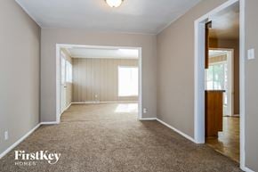 Hazelwood house for rent - A carpeted room with a doorway leading to another room.