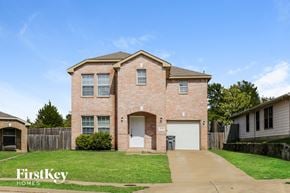 Dallas house for rent - A brick house with a garage is for sale.