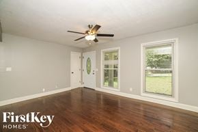 Douglasville house for rent - the living room of an empty house with a ceiling fan