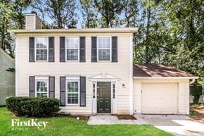 Lithonia house for rent - a white house with black shutters and a black front door