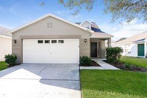 Lithia house for rent - A two-car garage is attached to a house.