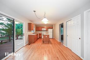 Florence house for rent - A kitchen with wooden floors and white walls.