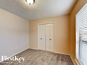 Arlington house for rent - a bedroom with a white door and a window