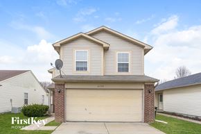 Indianapolis house for rent - A two-story house with a garage is for sale.