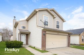 Indianapolis house for rent - A house with a garage and a driveway is for sale.