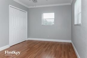 Sunrise house for rent - the second bedroom with hardwood flooring and a window