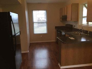 Galloway house for rent - an empty kitchen with a sink and a refrigerator