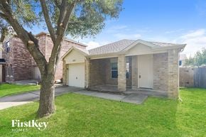 Katy house for rent - A house with a tree in front of it is for sale by FirstKey Homes.