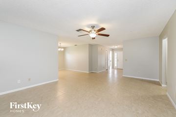 Lakeland house for rent - the spacious living room and dining room with ceiling fan and tile flooring