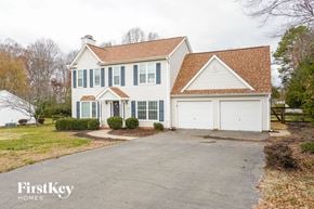 Clemmons house for rent - a white house with a garage and a driveway