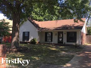 Memphis house for rent - a white house with a tree in front of it