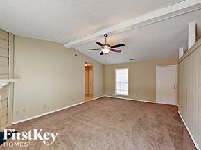 Charlotte house for rent - A room with a ceiling fan and a window.